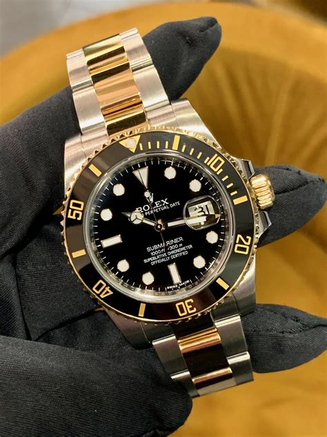 gold and steel rolex submariner